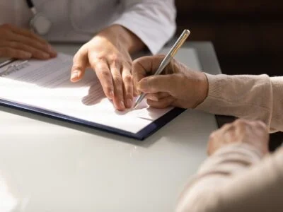 Photo of a Woman Filling Out Form