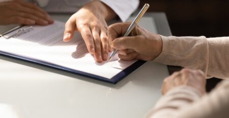 Photo of a Woman Filling Out Form