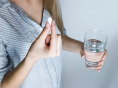 Photo of a Person Taking Medicine