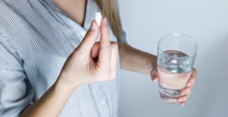 Photo of a Person Taking Medicine